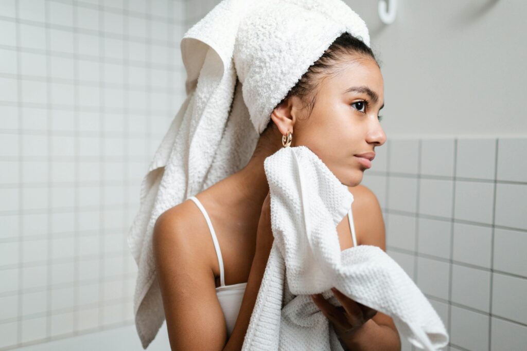 Experienced dermatologist examining patient skin for personalized treatment at Oswal Jain Skin Clinic Rohini